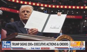 Fox News screenshot of Donald Trump holding up an executive order