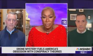 still of David Jolly, Joy Reid, Angelo Carusone; chyron: Drone mystery fuels America's obsession with conspiracy theories