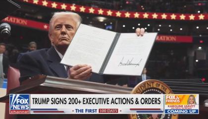 Fox News screenshot of Donald Trump holding up an executive order