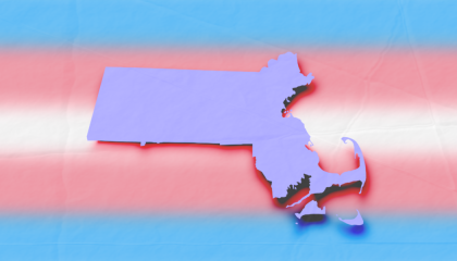 The state of Massachusetts in periwinkle with a drop shadow over a trans flag